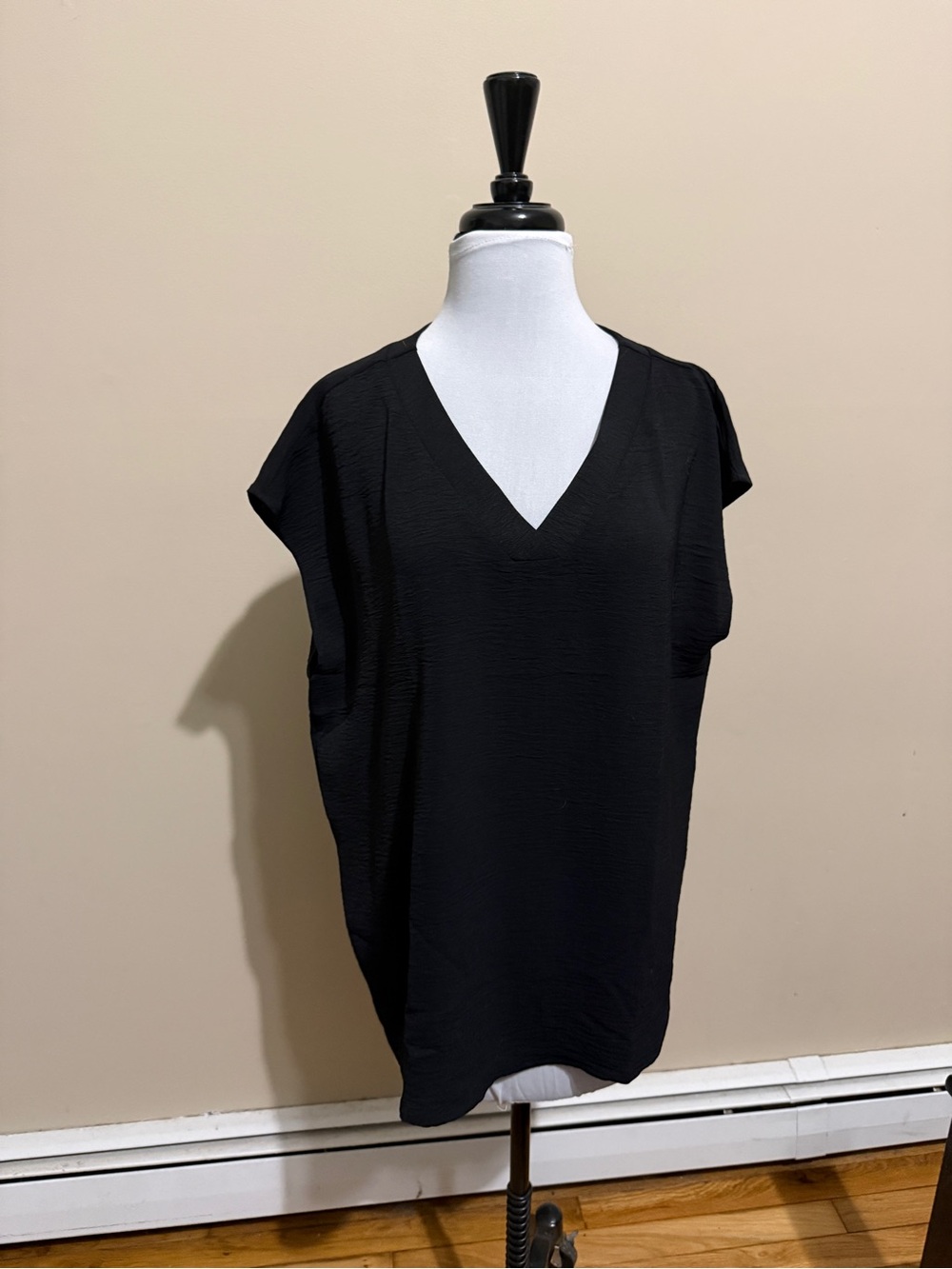 Black vneck sleeveless blouse - new, no tags.